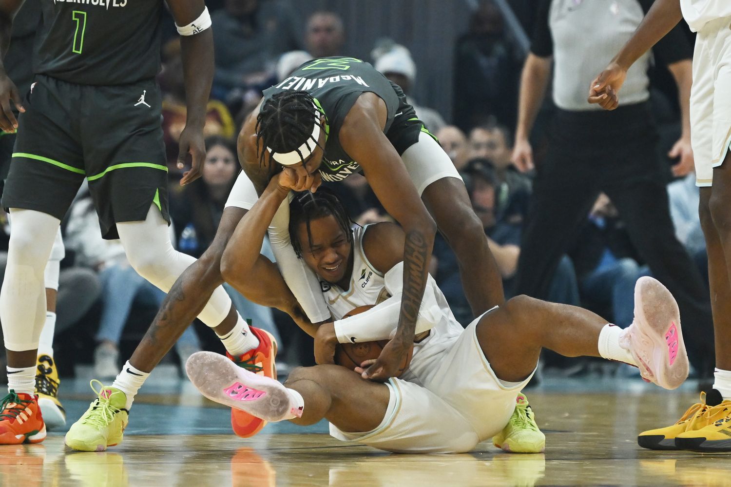 Minnesota Timberwolves forward Jaden McDaniels (3) and Cleveland Cavaliers forward Isaac Okoro (35) fight for possession during the first half at Rocket Mortgage FieldHouse.